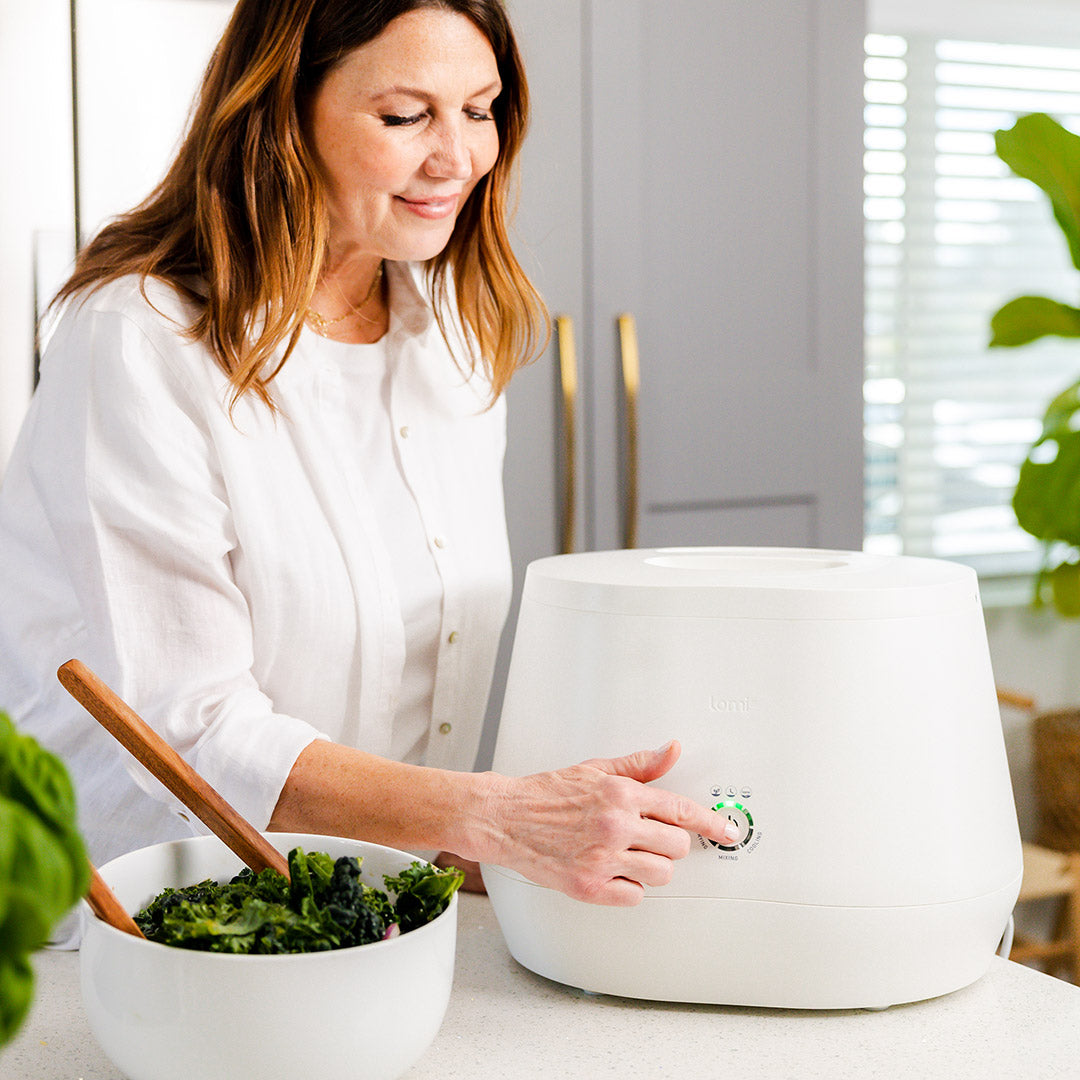Woman starting Lomi composter